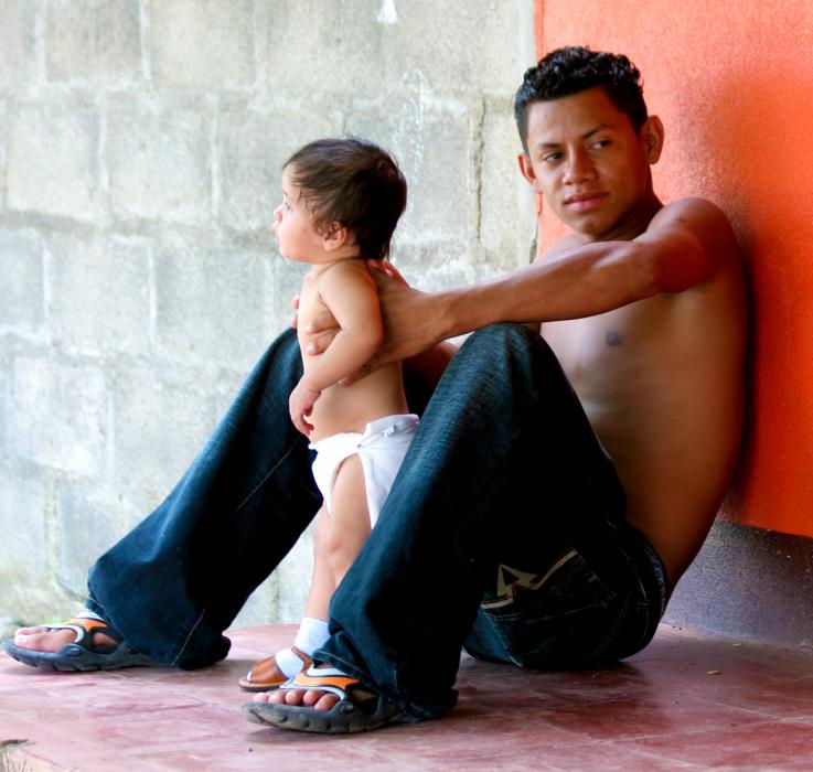 Young Father and Child. Photograph by Dan Mangan